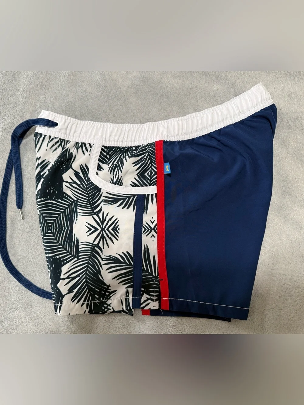 Andrew Christian lined swim trunks. They are a men’s large.